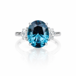 Lab Created Oval Lab-Created Laguna‑Color Sapphire Ring with Cadillac cut Lab Grown Diamond Side Stones